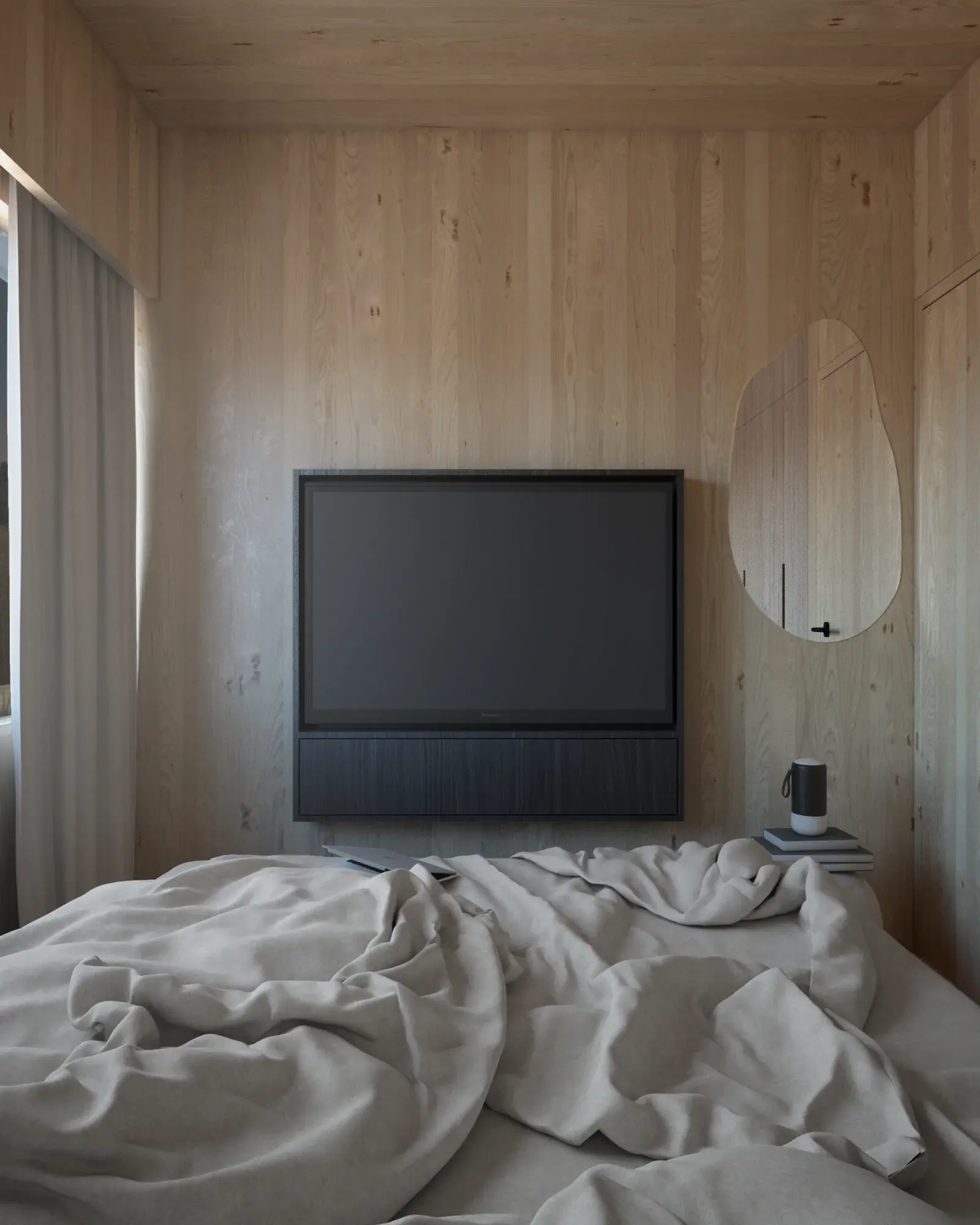 Visualisation of a bedroom in a Hombee Home modular home seen from the bed, with a TV on the CLT timber wall and an organically shaped mirror