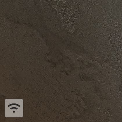 Close-ups of a textured, beige wall, with a white, oblong sensor mounted in the corner in the central part.