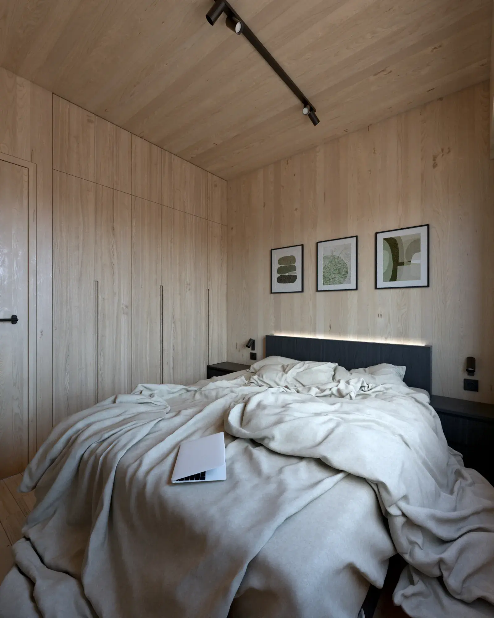 Visualisation of a bedroom in a Hombee Home modular home with built-in timber wardrobes, a backlit headboard and framed prints