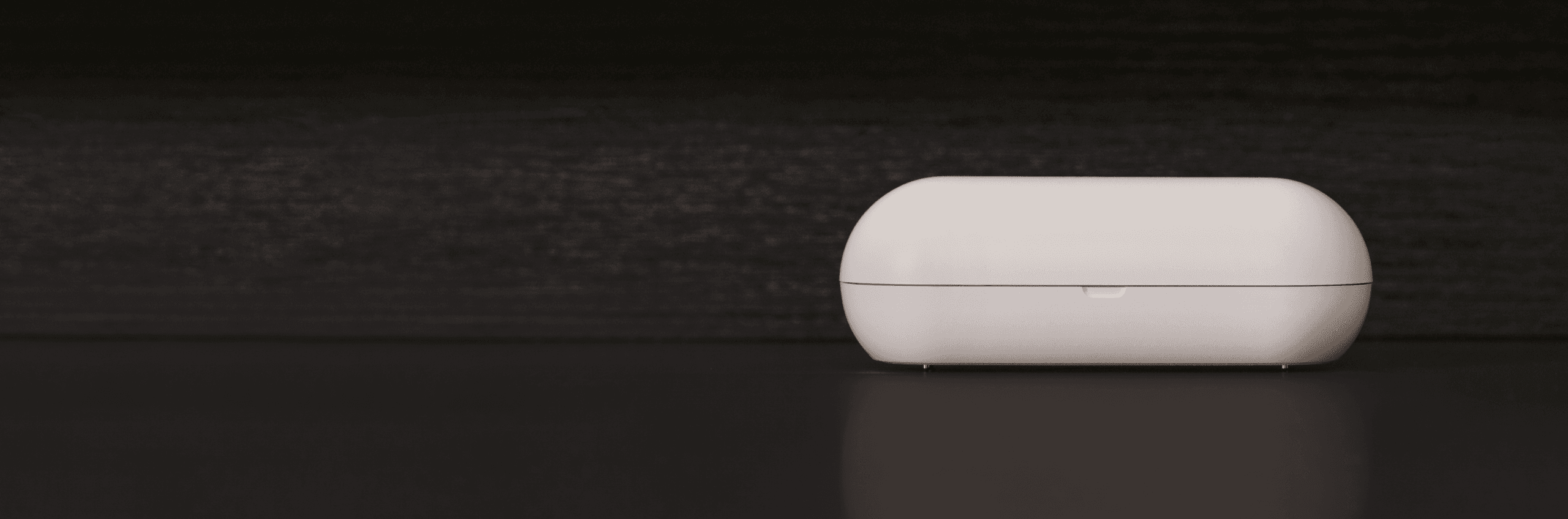 A Hombee OS device on a dark countertop.